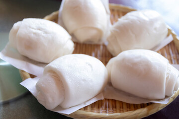 Chinese steamed buns (Mantou)  in a basket. 