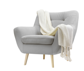 Comfortable velour Armchair with knitted plaid on white background