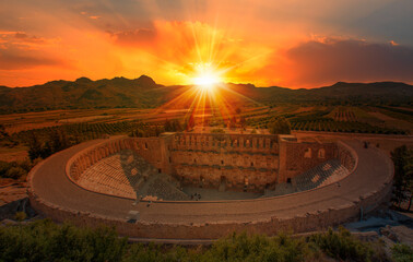 Fototapeta premium Roman amphitheater of Aspendos, Belkiz at sunset - Antalya, Turkey