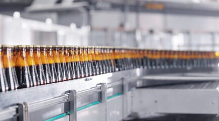 Mass Product of Beer Bottles, Rows of glass production alcohol on industrial conveyor belt