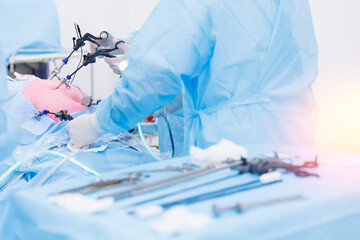 Operation process on abdominal, blue light. Modern laparoscopic equipment, doctor surgery working,...