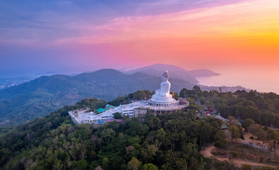 Aerial top view statue big Buddha in Phuket on sunset sky. Concept travel Thailand landmark.
