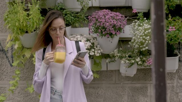 Business woman drinking healthy drink outdoor