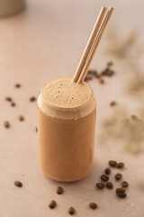 Coffee smoothie on a coffee shop table. Vegan smoothie, healthy drink. Top view.