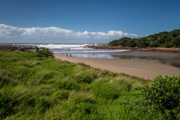 Fototapeta na wymiar The Wild Coast, known also as the Transkei, is a 250 Kilometre long stretch of tropical beach rocky shores waterfalls and steamy jungle or coastal forests. The rugged and unspoiled Coastline that stre