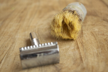 old shaving brush and manual razor