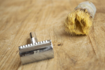 old shaving brush and manual razor