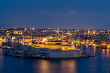 Fototapeta na wymiar Vittoriosa, also known as Il-Birgu, in twilight, seen from Valletta, Malta