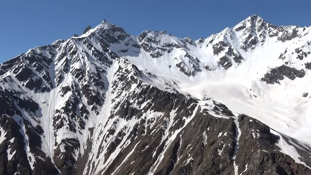 Mountains of the main Caucasian ridge on a sunny cloudless day. Kabardino-Balkaria, Russia