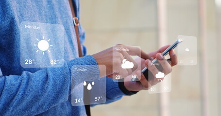 Image of weather forecast over biracial man using smartphone