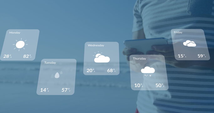 Image of weather forecast over caucasian man using tablet - Powered by Adobe