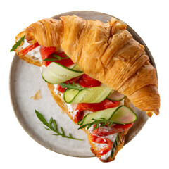 Croissant sandwich with cream cheese, smoked salmon, cucumber and arugula on gray plate isolated on white. Top view.