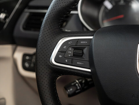 Novosibirsk, Russia - February  20 , 2024:  Hongqi H5 ,   Close up of car steering wheel with function buttons