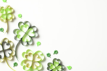 Happy Saint Patricks day greeting card design. Flat lay four leaf clover flowers on white background
