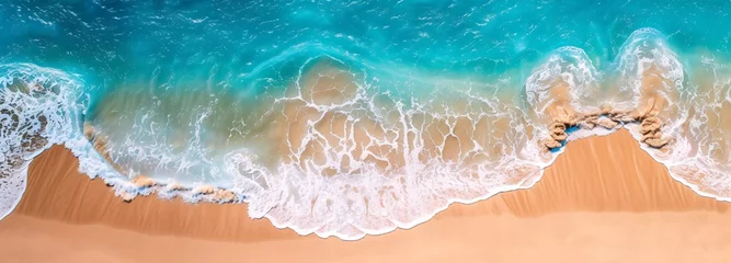 Schilderijen op glas a blue ocean waves on a sandy beach © Ion