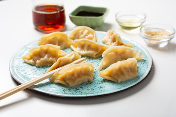 Close up of bolied gyoza chinese dumplings on plate food