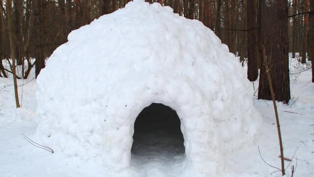 A small house made of snow. Children's igloo for games. A copy of the traditional dwelling of the inhabitants of the north.