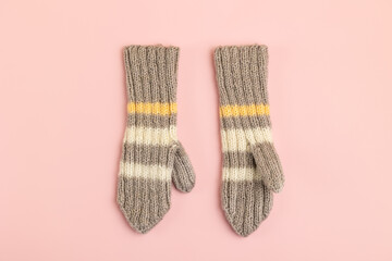 A pair of knitted mittens on the table