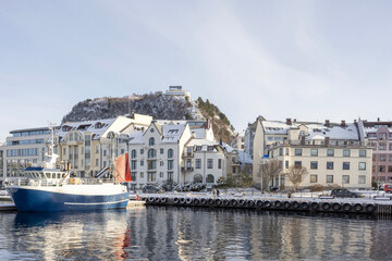 Fototapeta na wymiar The Jugend city Aalesund (Ålesund) harbor on a beautiful cold winter's day. Møre and Romsdal county 