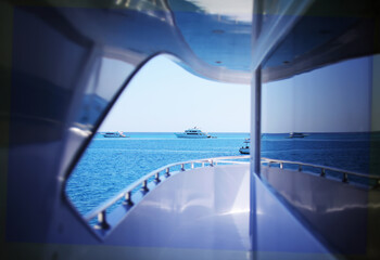 Seascape with white yacht sailing the sea