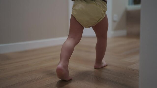baby run along the corridor indoors. happy family kid dream concept. baby first steps playing run around at home. son, child, active, runs, takes first steps, plays indoors lifestyle