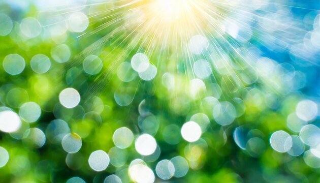 blurred white bokeh lights on blue green background abstract sky with bubbles or circles in magical fantasy design beautiful spring or summer background