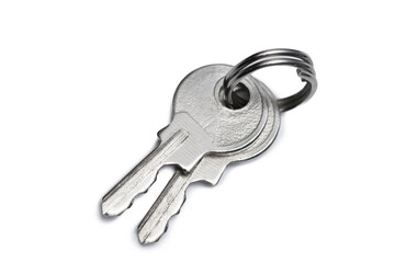 Srebrne klucze izolowane leżą na białym tle, kupować mieszkanie