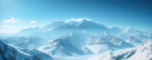 Majestic snow-capped mountain peaks under a clear blue sky.