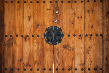 The wooden gate door of traditional Korean style architecture (hanok) in Seoul, South Korea.