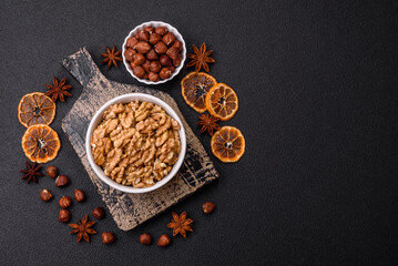Delicious fresh peeled raw walnuts in a ceramic plate