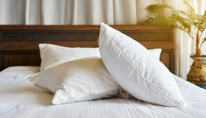 White pillow on bed in bedroom closeup