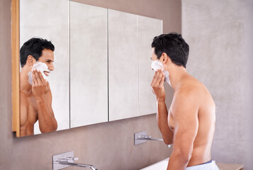 Skincare, mirror and man with foam on face in bathroom for shaving, grooming and hair removal....