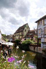Fototapeta na wymiar Petite Venice, water canal and traditional half timbered houses located in Colmar, France