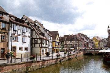 Fototapeta na wymiar Petite Venice, water canal and traditional half timbered houses located in Colmar, France