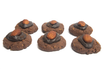 Group of afghan cookies made from chocolate and cornflakes with almond on top isolated on white background clipping path