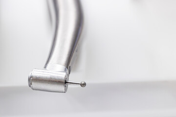 Close-up of dental drill. stainless steel tap,  bur .
