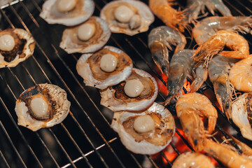 Scallops and shrimp grilled over charcoal grill