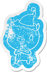 happy cartoon distressed sticker of a pig wearing santa hat
