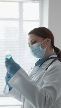 A medical specialist carefully draws a drug into a syringe before performing a medical procedure, demonstrating accuracy and professionalism in the hospital. Medical Clinic, Doctor's Office