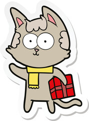 sticker of a happy cartoon cat with christmas present
