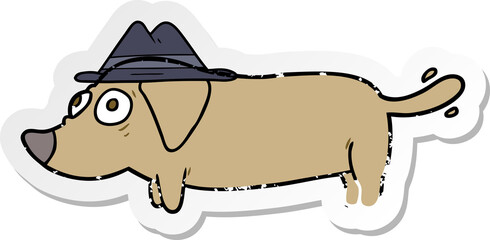 distressed sticker of a cartoon dog wearing hat