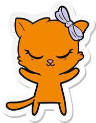 sticker of a cute cartoon cat with bow