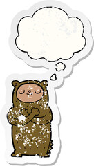 cartoon bear and thought bubble as a distressed worn sticker