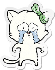 distressed sticker of a cartoon cat