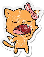 distressed sticker of a cartoon yawning cat