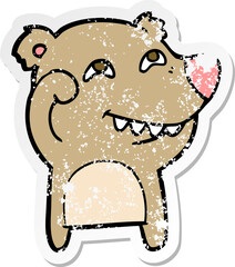 distressed sticker of a cartoon bear showing teeth