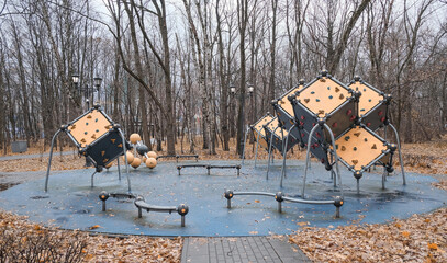 playground with abstract figures in an autumn park