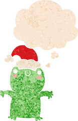 cute cartoon frog wearing christmas hat and thought bubble in retro textured style