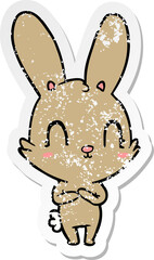distressed sticker of a cute cartoon rabbit