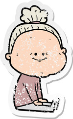 distressed sticker of a cartoon happy old woman